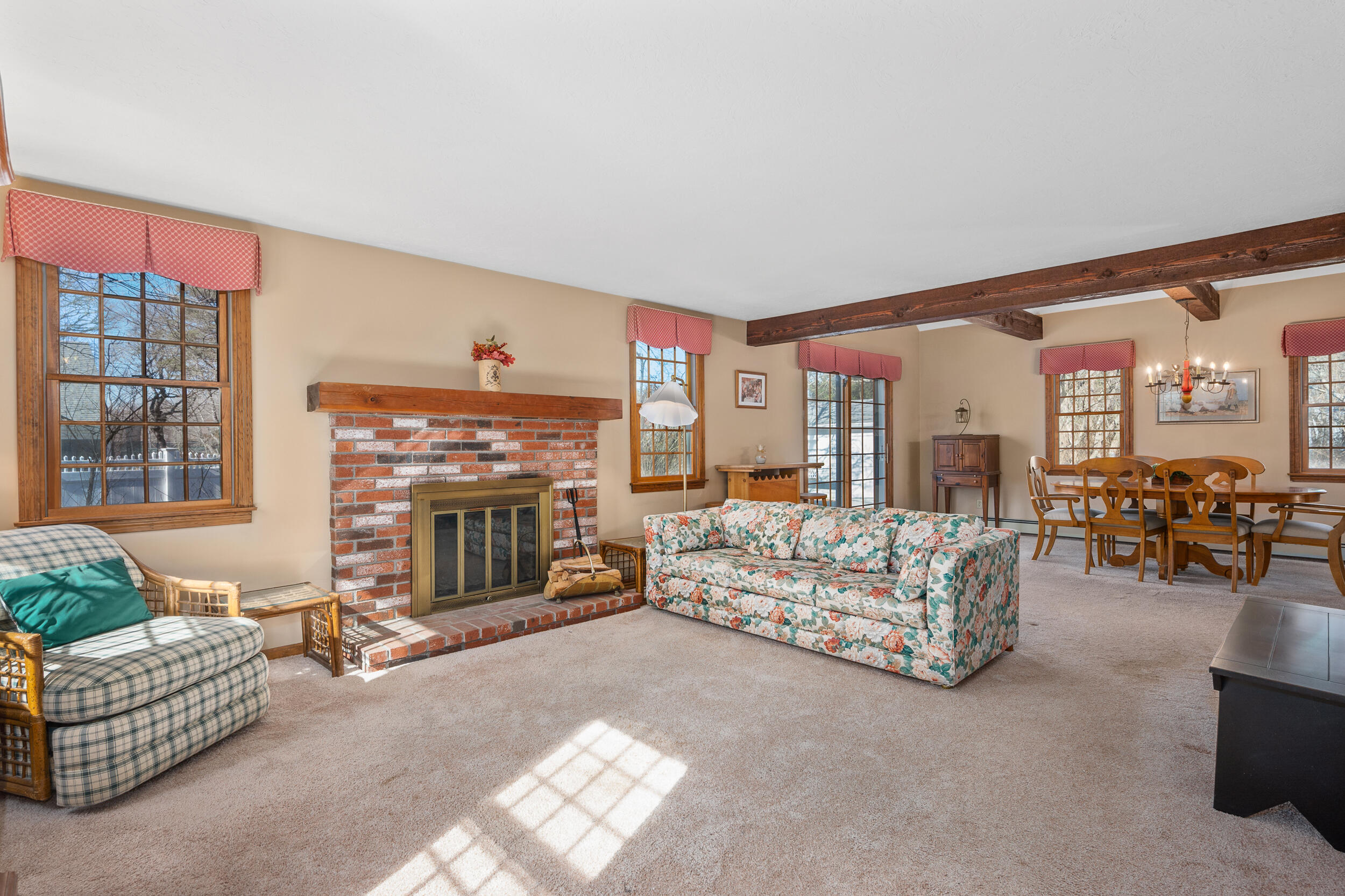 4 Ralyn Road Cotuit, MA 02635 - Photo 4 of 53 a living room with furniture and a fireplace