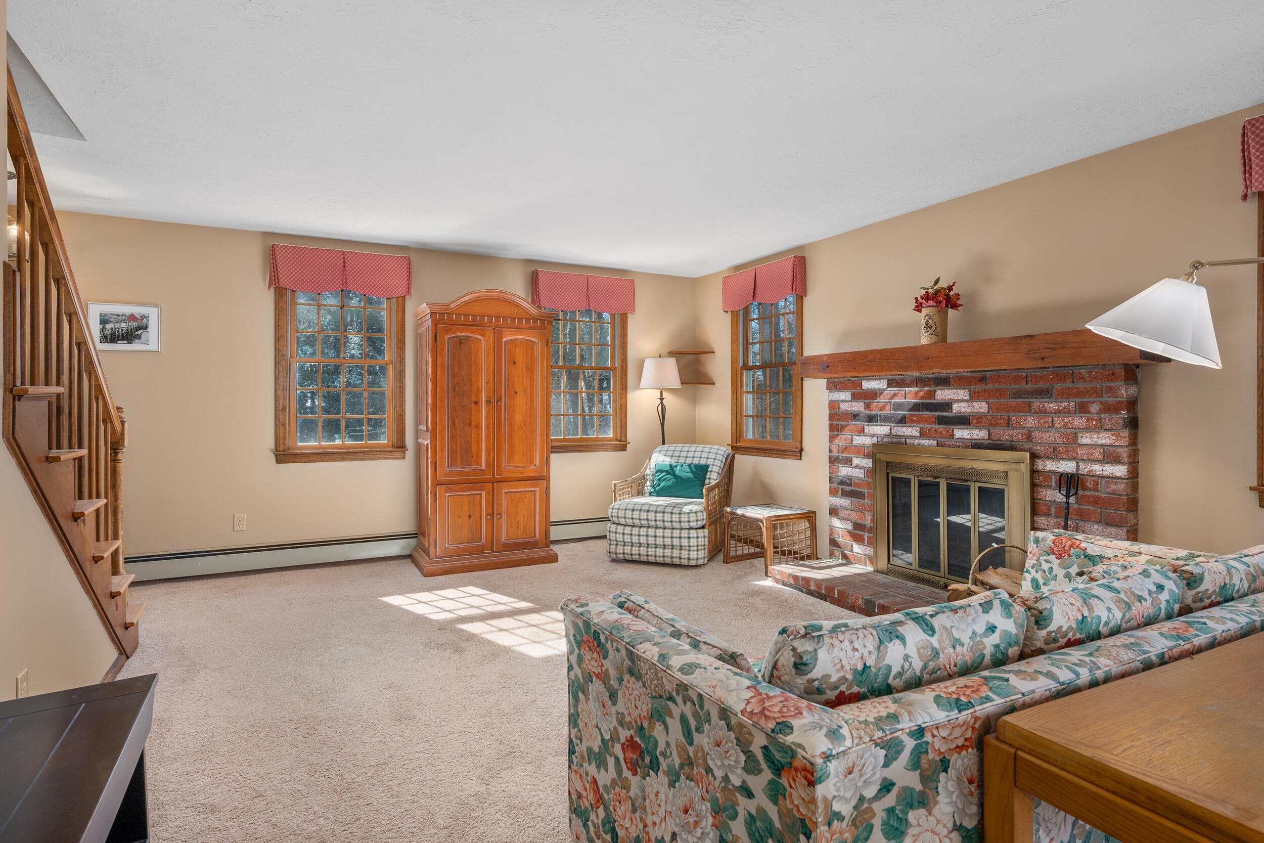 4 Ralyn Road Cotuit, MA 02635 - Photo 5 of 53 a living room with furniture a fireplace and a flat screen tv
