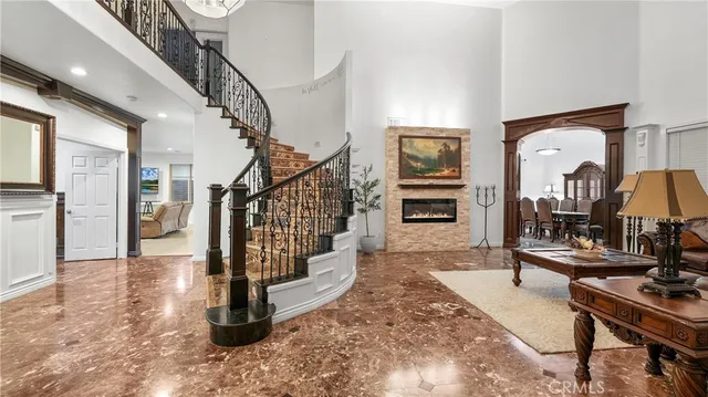 a living room with fireplace furniture and a flat screen tv