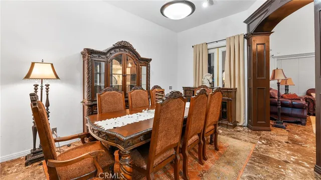 a bedroom with a bed and a mirror