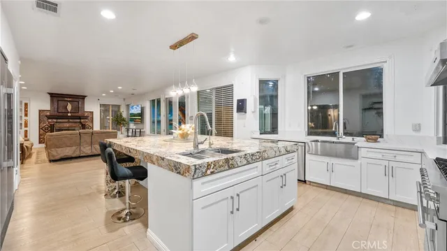 a bed sitting in a spacious bedroom next to a window