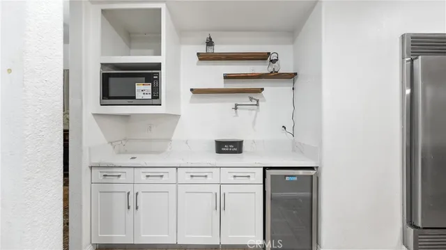 a spacious bathroom with a double vanity sink mirror and a bathtub