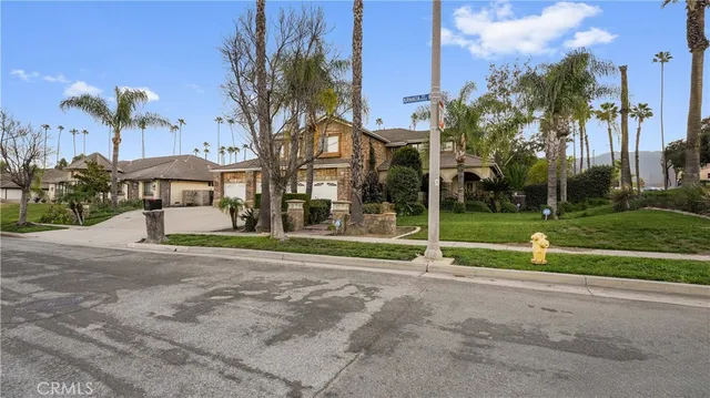 a living room with furniture a rug and a table