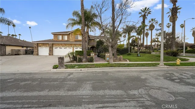 a view of a dining room with furniture and a potted plant
