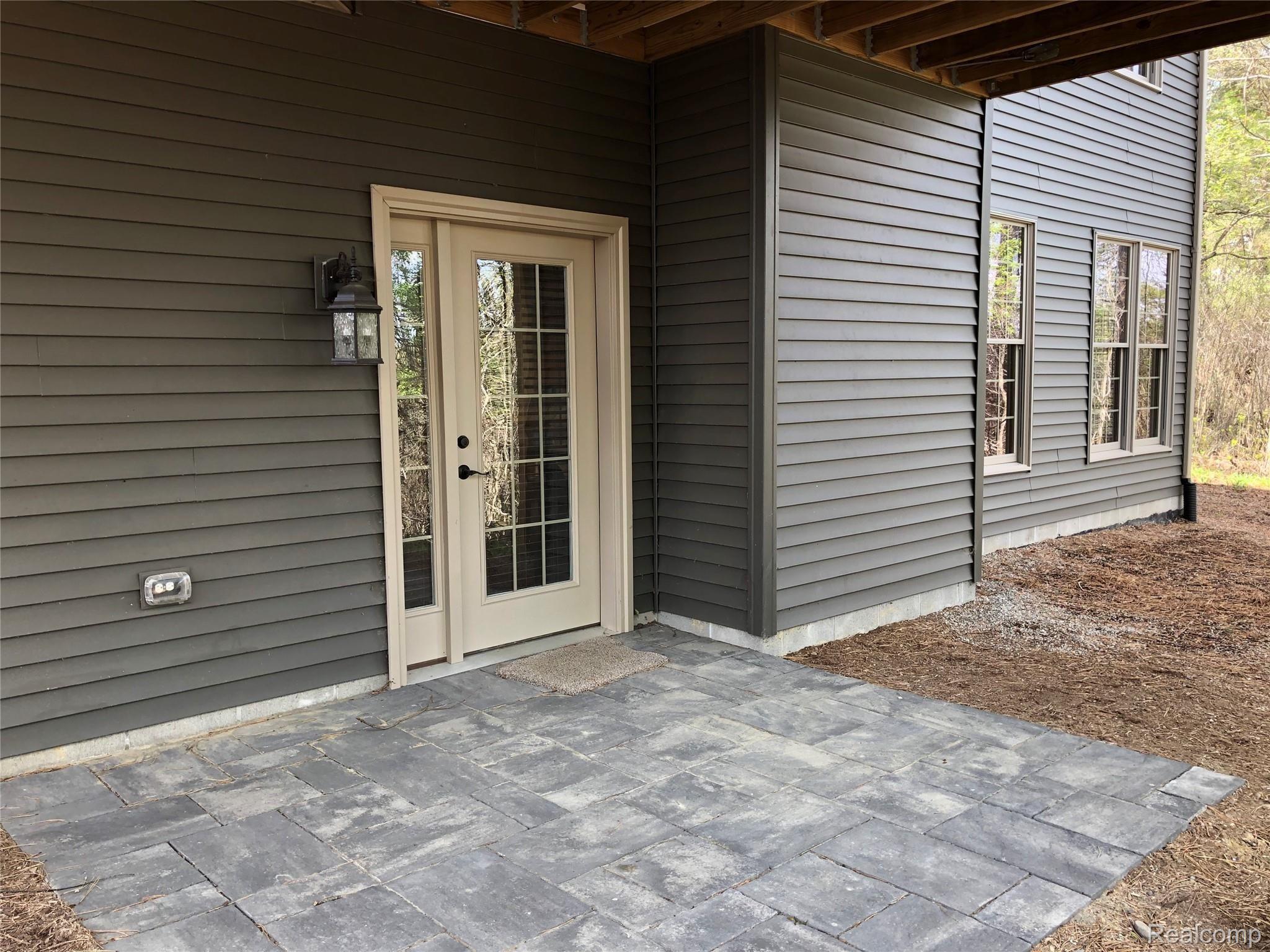 6263 General Squier Road Almont, MI 48003 - Photo 38 of 45 Basement entrance with patio