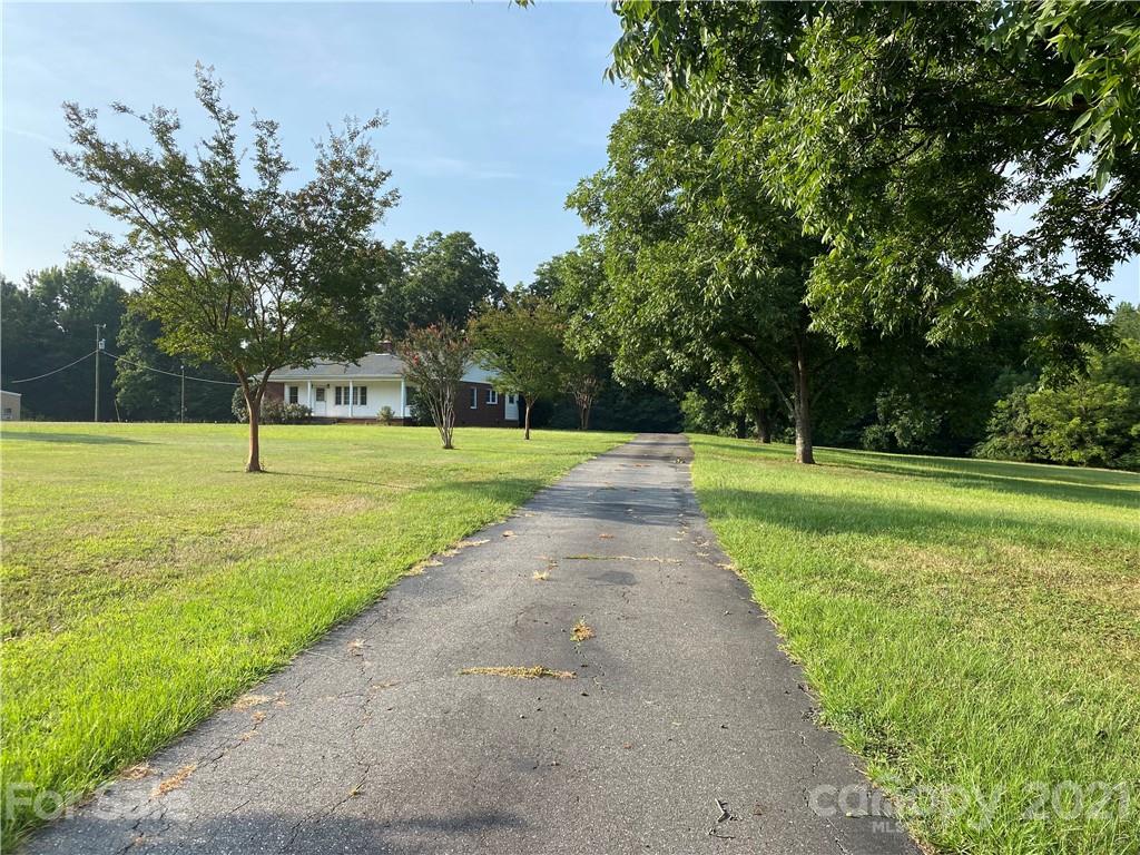 1565 Springlake Road York, SC 29745 - Photo 1 of 18 a view of a big yard with a trees