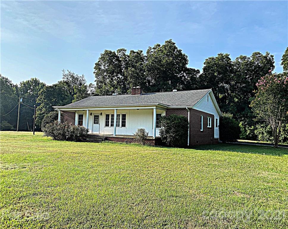 1565 Springlake Road York, SC 29745 - Photo 2 of 18 a front view of a house with yard and green space