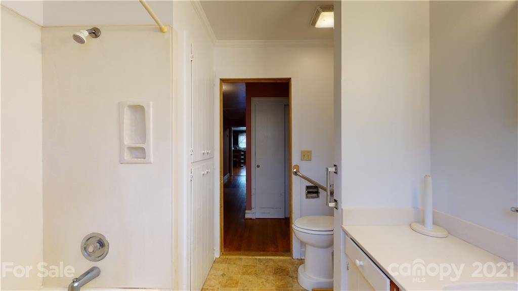 1565 Springlake Road York, SC 29745 - Photo 11 of 18 a bathroom with a granite countertop sink toilet and shower