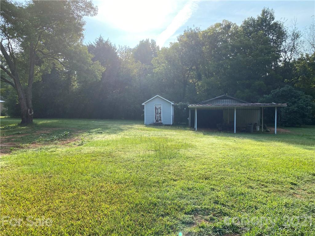 1565 Springlake Road York, SC 29745 - Photo 18 of 18 a view of a house with a backyard