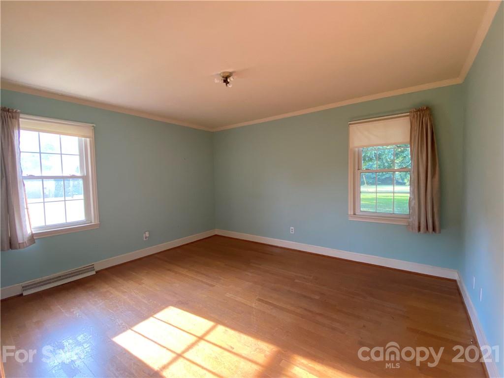 1565 Springlake Road York, SC 29745 - Photo 3 of 18 a view of an empty room with wooden floor and a window