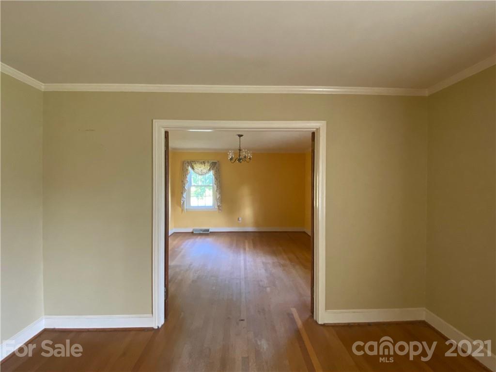 1565 Springlake Road York, SC 29745 - Photo 4 of 18 a view of an empty room with wooden floor and a window