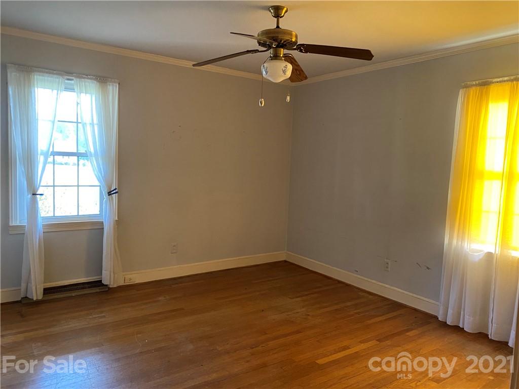 1565 Springlake Road York, SC 29745 - Photo 6 of 18 an empty room with a window and wooden floor