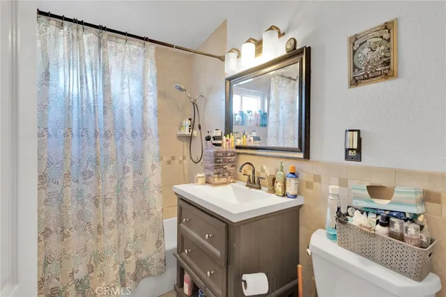 a bathroom with a sink vanity and a mirror