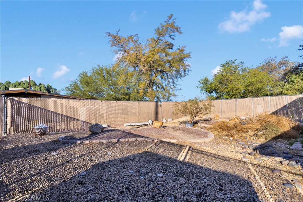 25488 Jade Road Barstow, CA 92311 - Photo 22 of 25 a backyard of a house with lots of green space