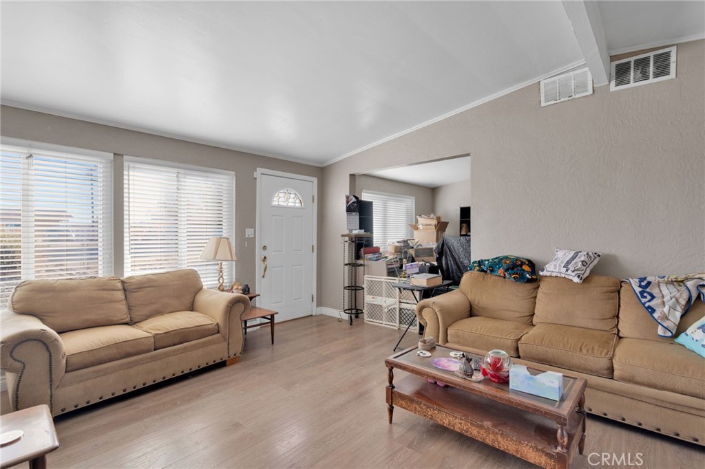25488 Jade Road Barstow, CA 92311 - Photo 5 of 25 a living room with furniture and a large window