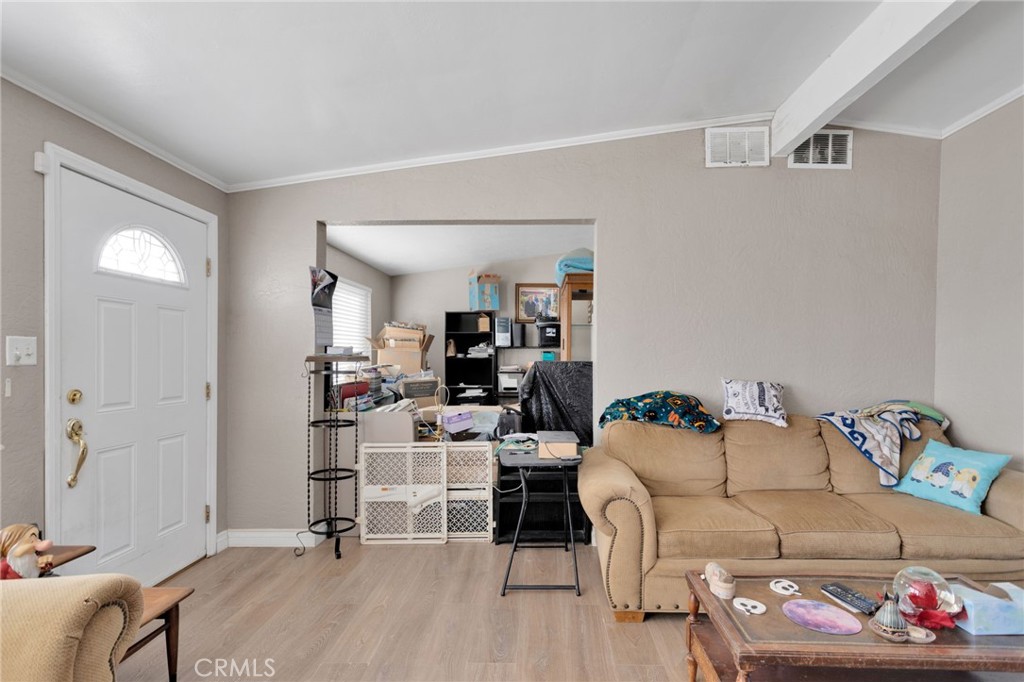 25488 Jade Road Barstow, CA 92311 - Photo 6 of 25 a living room with furniture and a couch