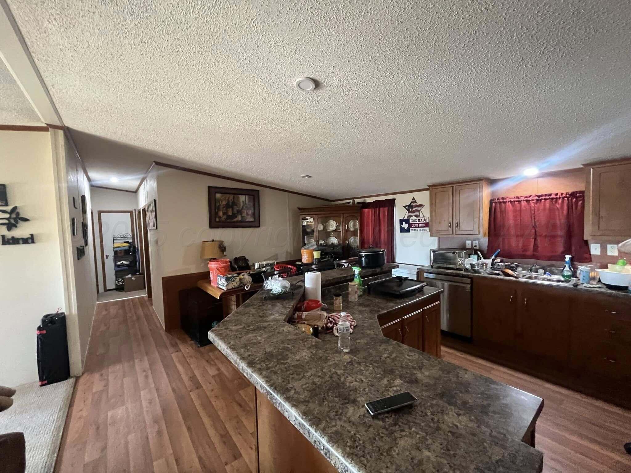 7101 Coyote Trail Amarillo, TX 79124 - Photo 4 of 14 a view of a living room and dining room