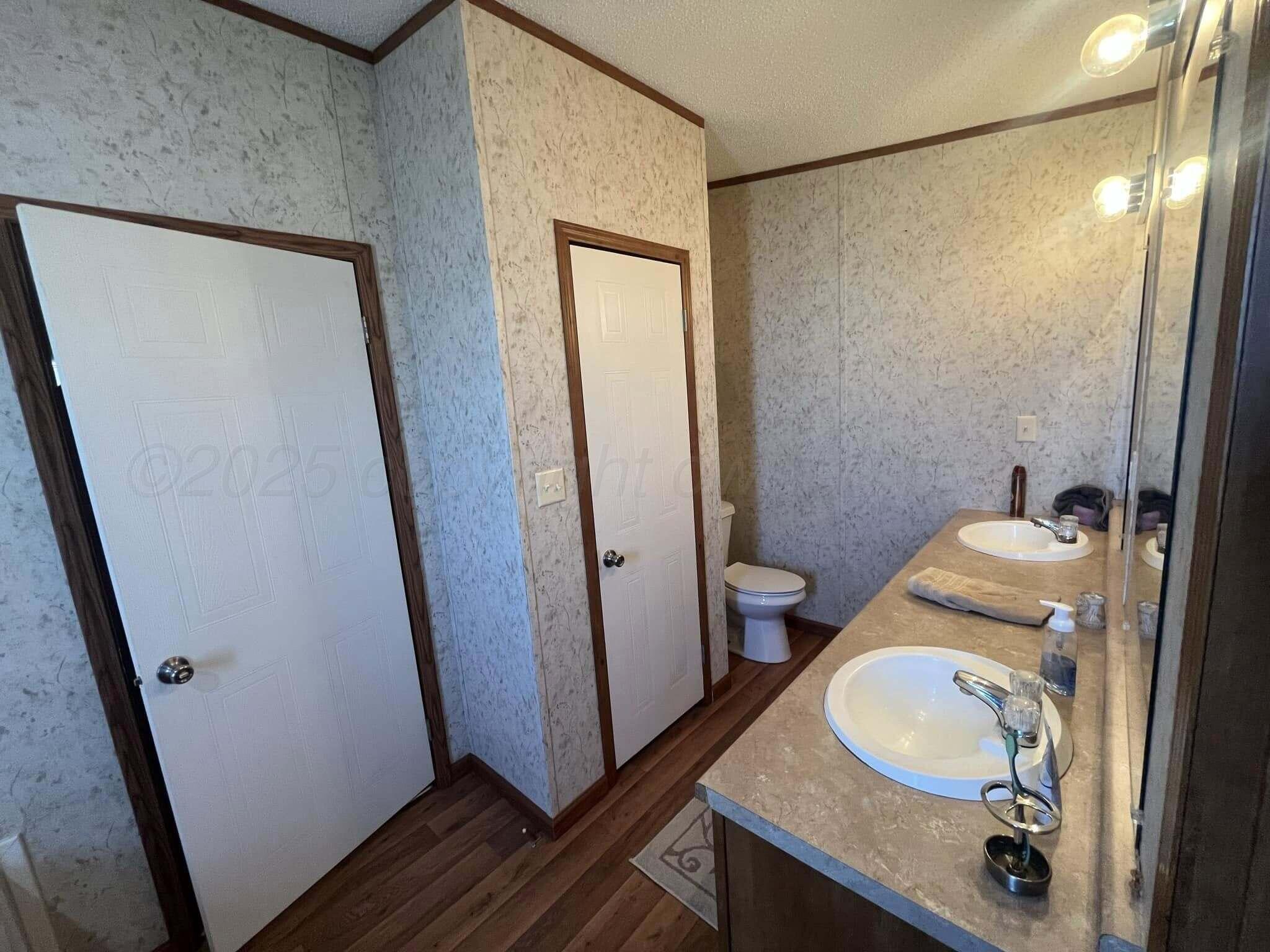 7101 Coyote Trail Amarillo, TX 79124 - Photo 8 of 14 a bathroom with a sink and a mirror