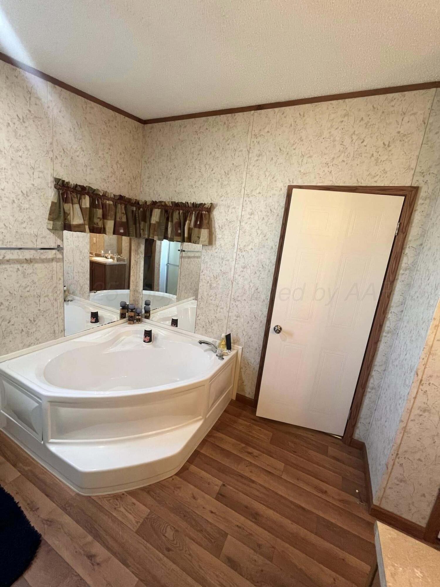 7101 Coyote Trail Amarillo, TX 79124 - Photo 10 of 14 a white bath tub sitting next to a white sink