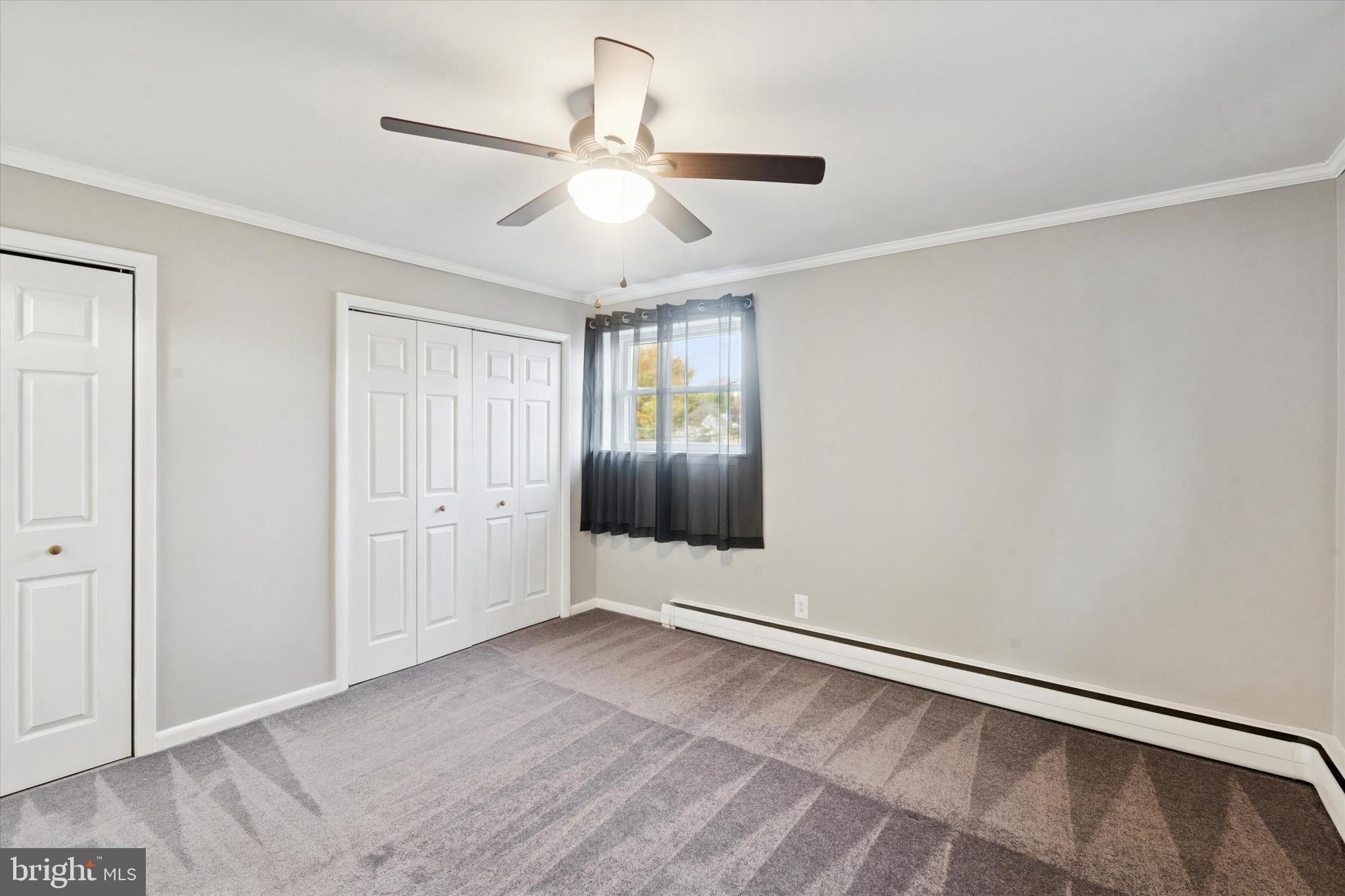 703 Hoffnagle Street, Unit 2 Philadelphia, PA 19111 - Photo 11 of 15 wooden floor in an empty room with a window
