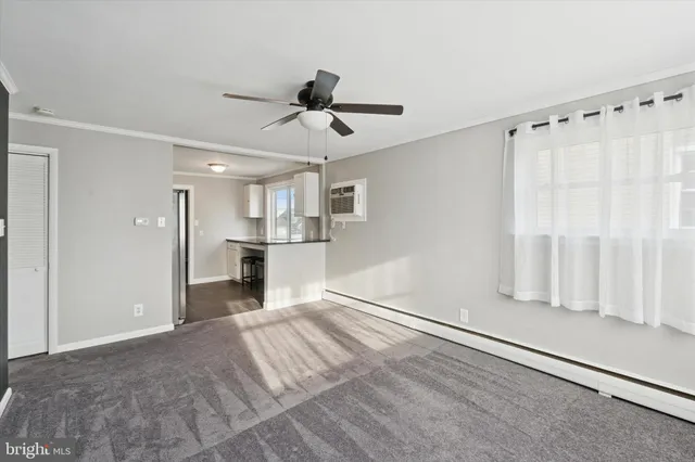 a view of a kitchen with a sink and cabinet area