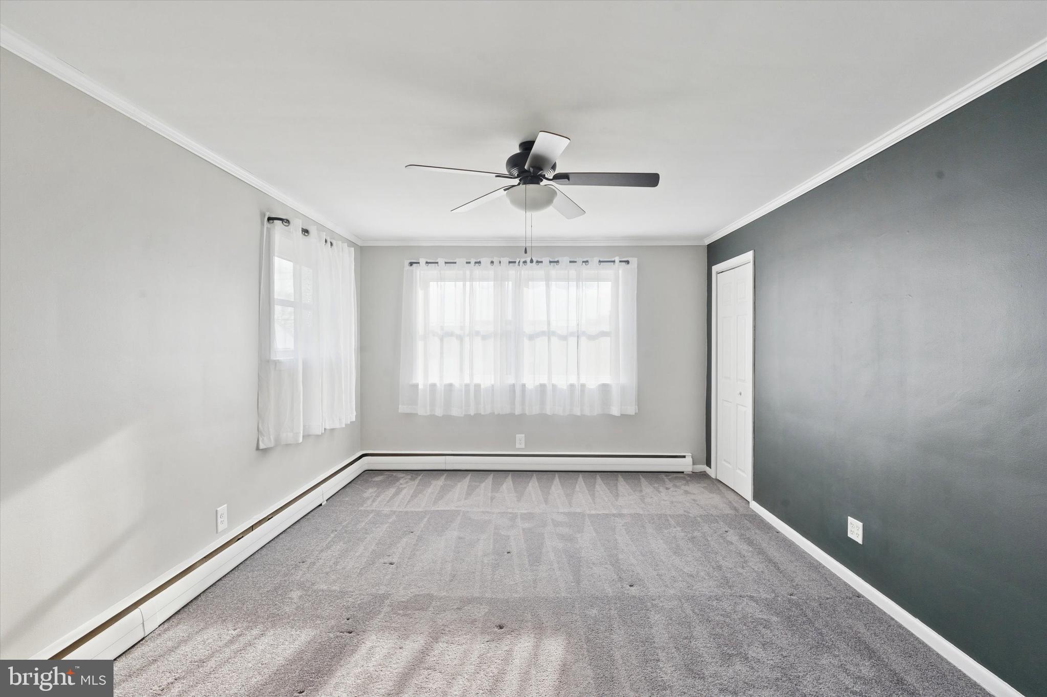 703 Hoffnagle Street, Unit 2 Philadelphia, PA 19111 - Photo 7 of 15 a view of an empty room with a window