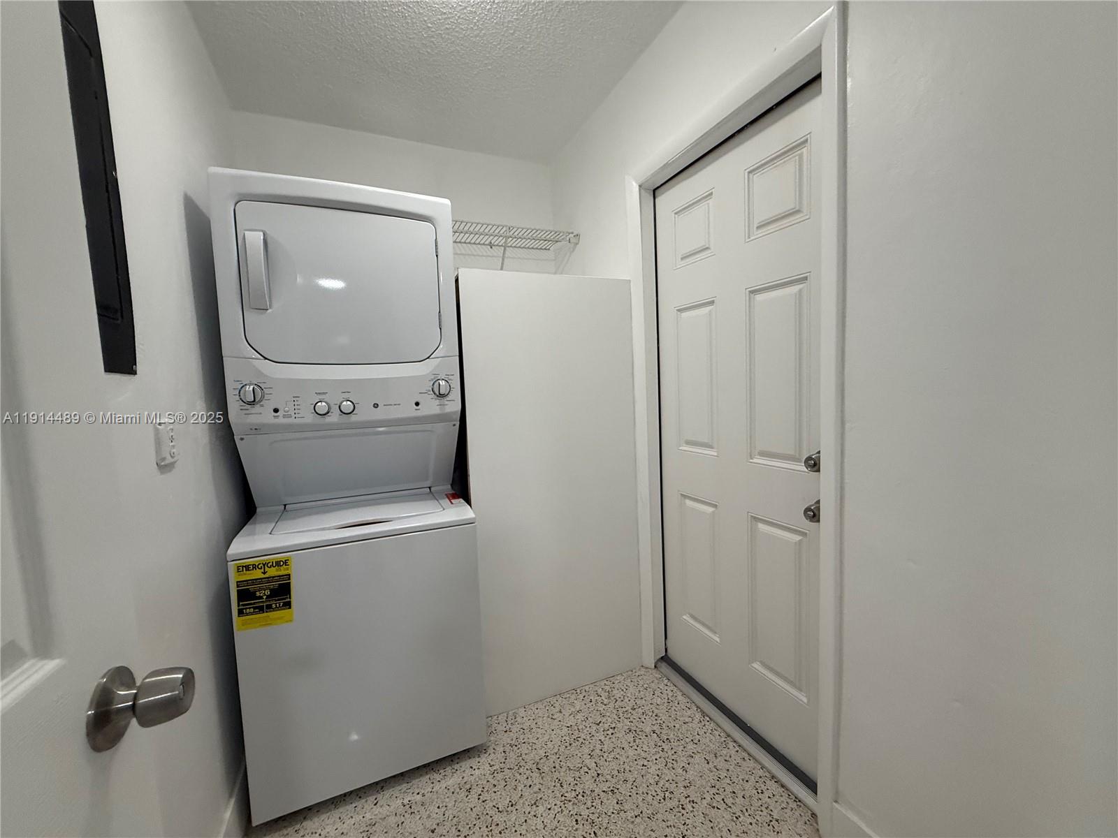 3146 Northwest 29th Street, Unit A Miami, FL 33142 - Photo 3 of 9 a utility room with dryer and washer