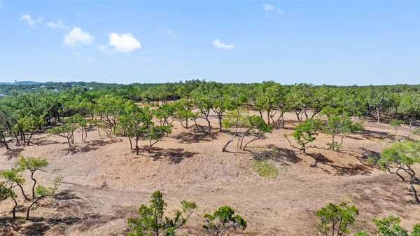 a view of a big yard with lots of green space