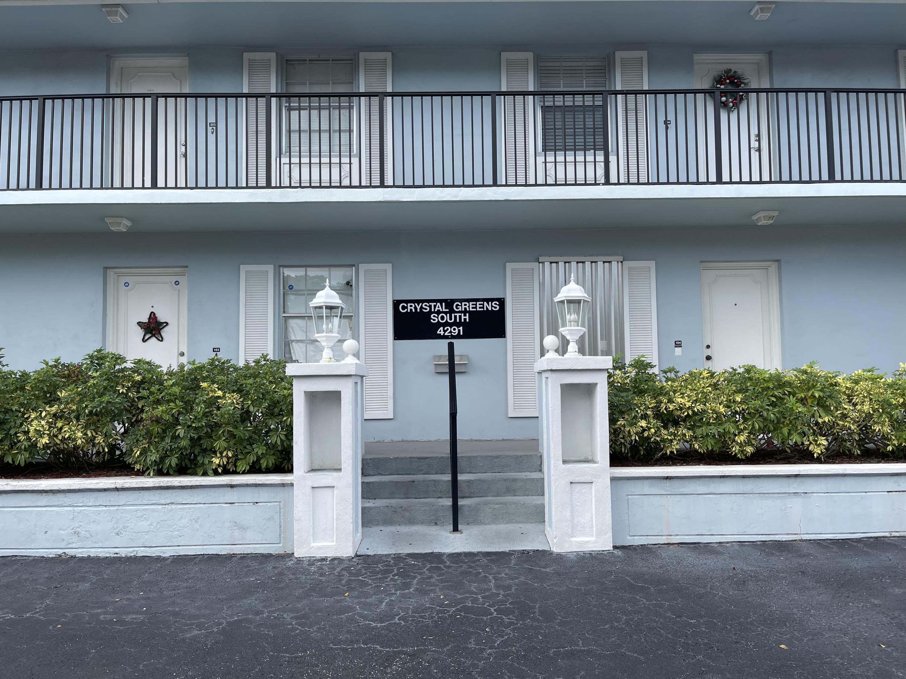 4291 Northwest 9th Avenue, Unit 104 Deerfield Beach, FL 33064 - Photo 1 of 11 a front view of a house