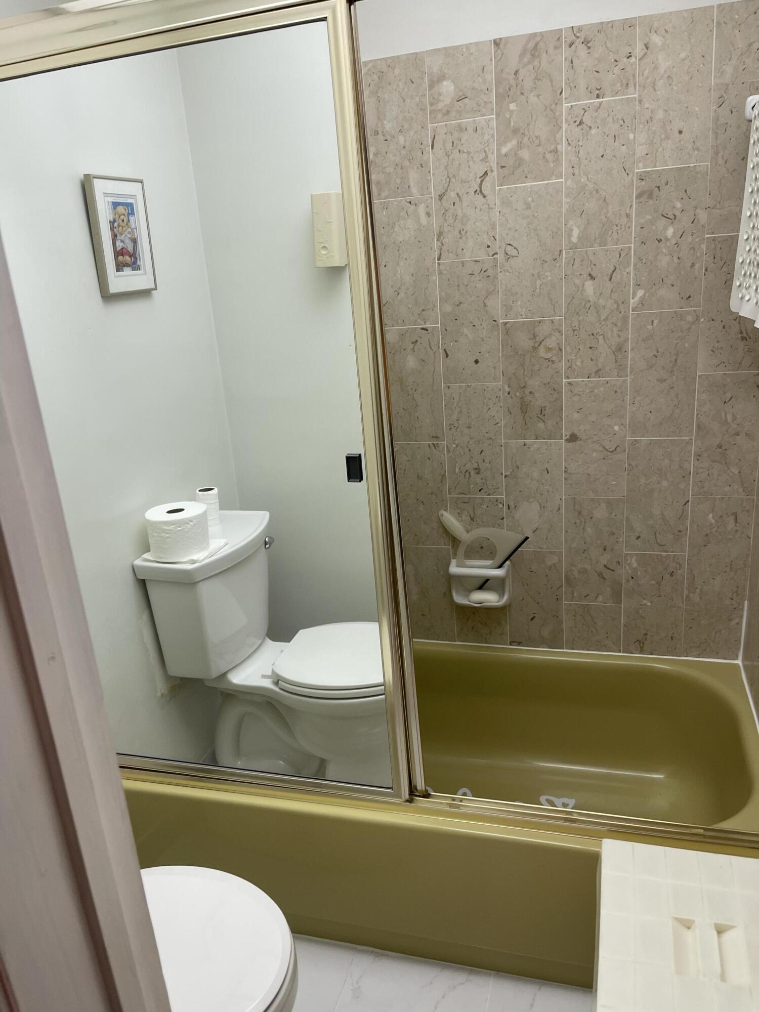 4291 Northwest 9th Avenue, Unit 104 Deerfield Beach, FL 33064 - Photo 6 of 11 a bathroom with a sink and a toilet