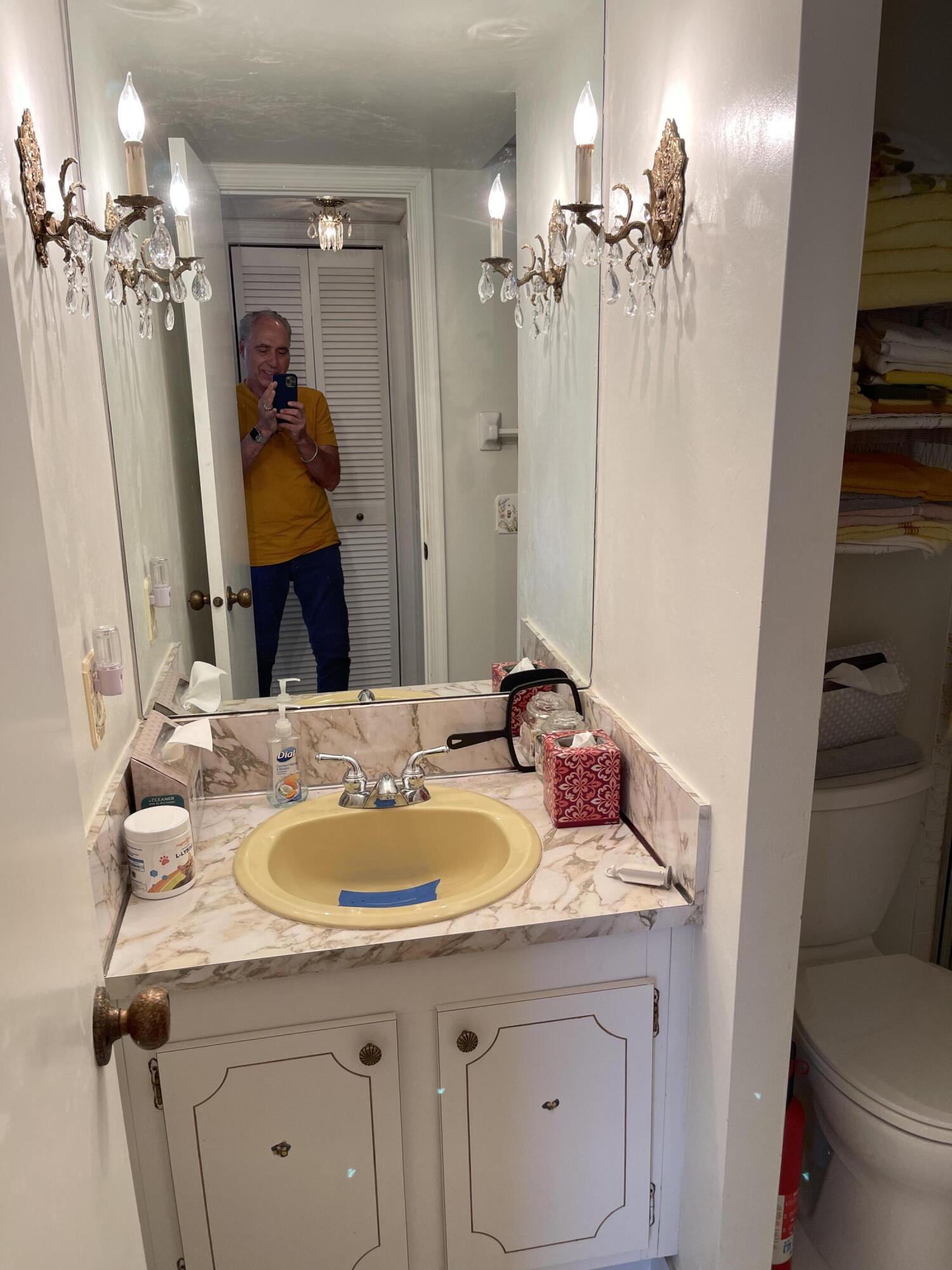 4291 Northwest 9th Avenue, Unit 104 Deerfield Beach, FL 33064 - Photo 9 of 11 a bathroom with a sink double vanity granite and a mirror
