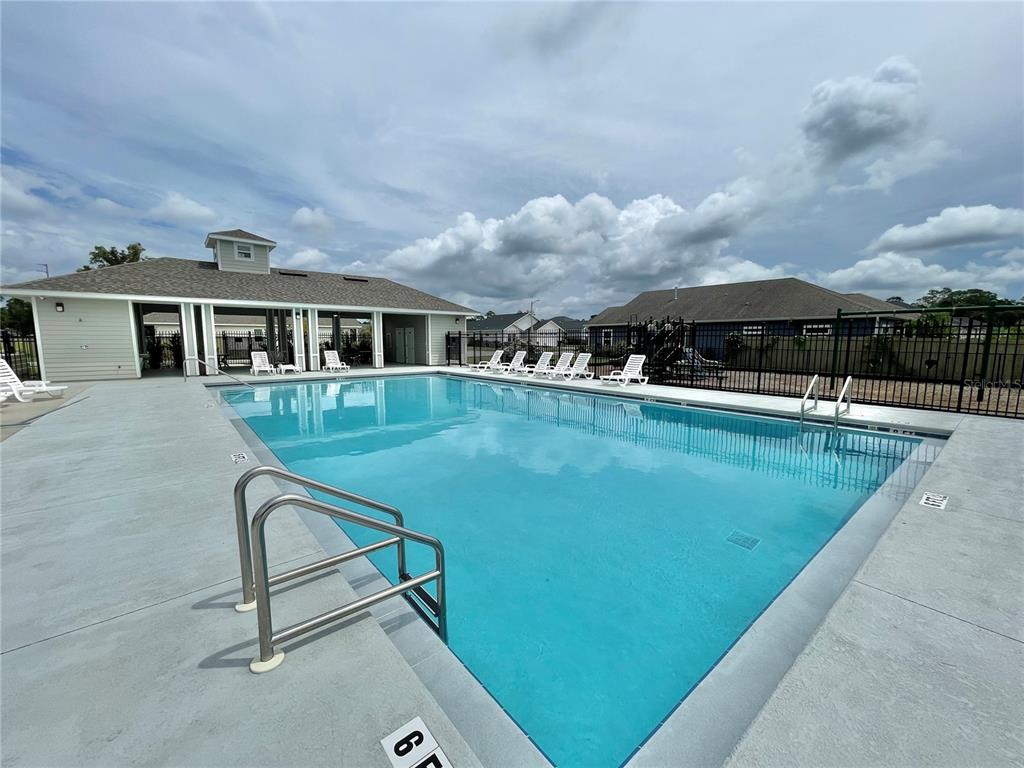 1021 Southwest 67th Street Gainesville, FL 32607 - Photo 47 of 53 a view of a patio with swimming pool and furniture