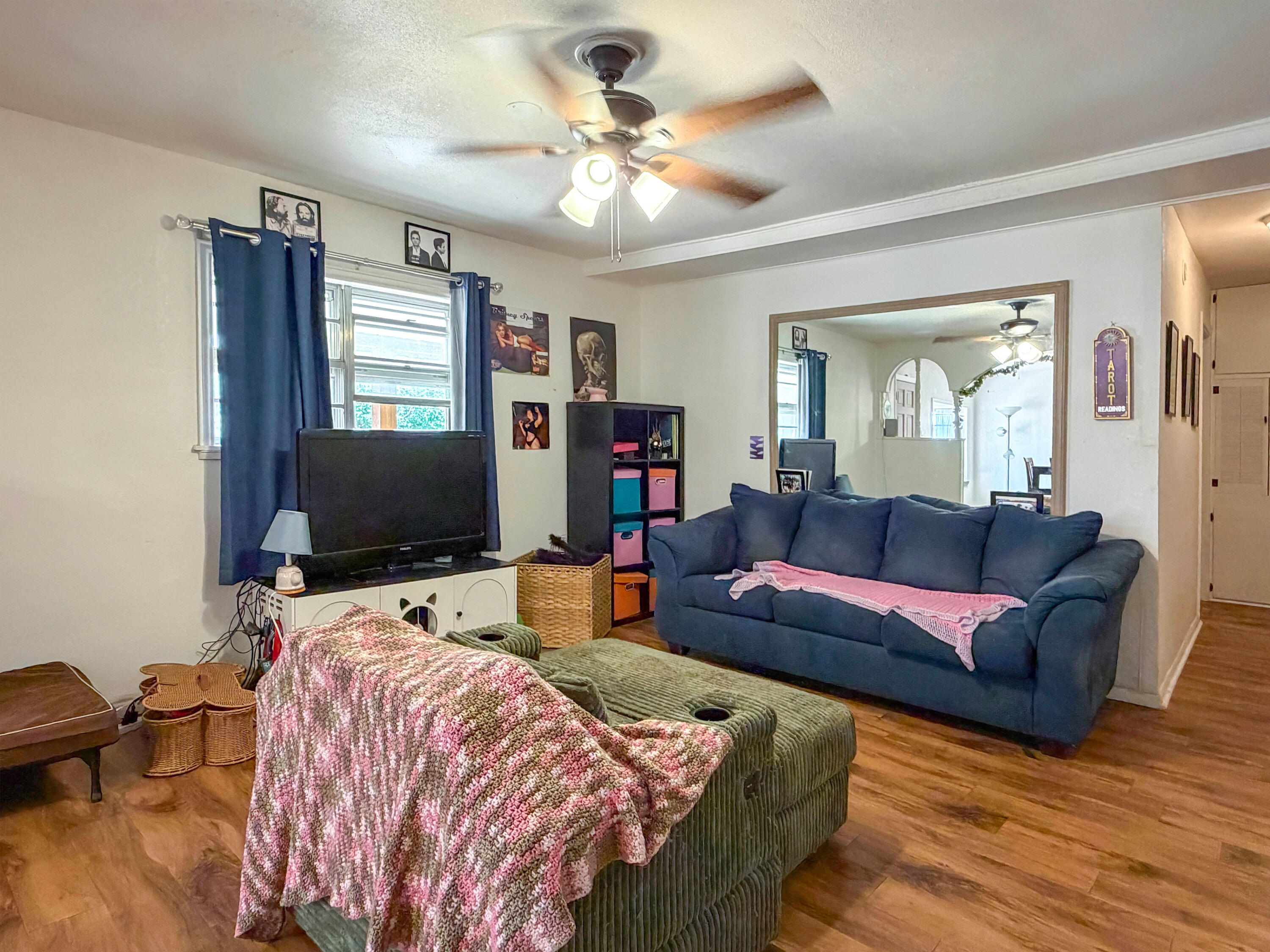 3221 Emory Street Lubbock, TX 79415 - Photo 6 of 15 a living room with furniture and a flat screen tv
