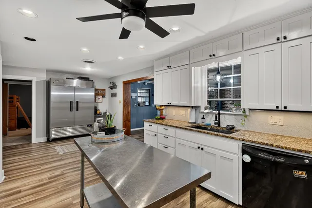 a large kitchen with cabinets