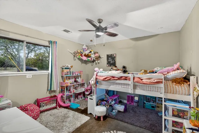 a work room with furniture and windows