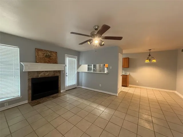a view of an empty room and fire place