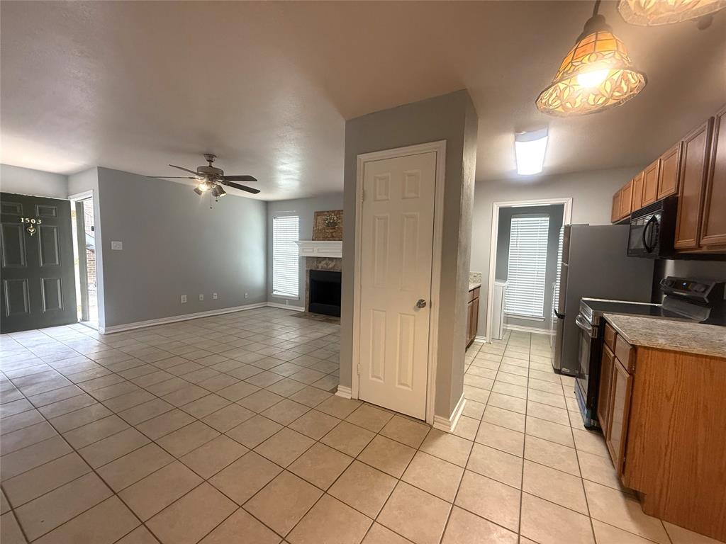 5981 Arapaho Road, Unit 1503 Dallas, TX 75248 - Photo 5 of 14 a view of a kitchen with a sink and a refrigerator