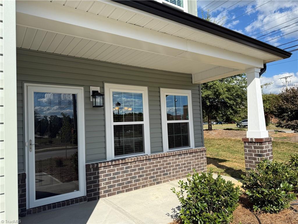 3301 Alyssa Way High Point, NC 27265 - Photo 23 of 43 Front porch and back screened porch