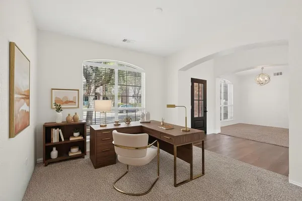 a view of an entryway with wooden floor