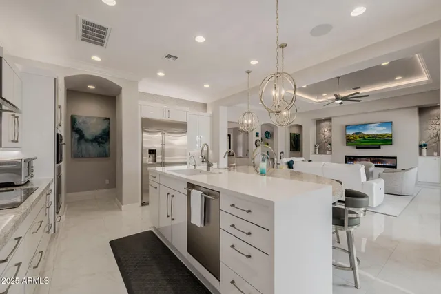 a view of a patio with table and chairs potted plants and large tree