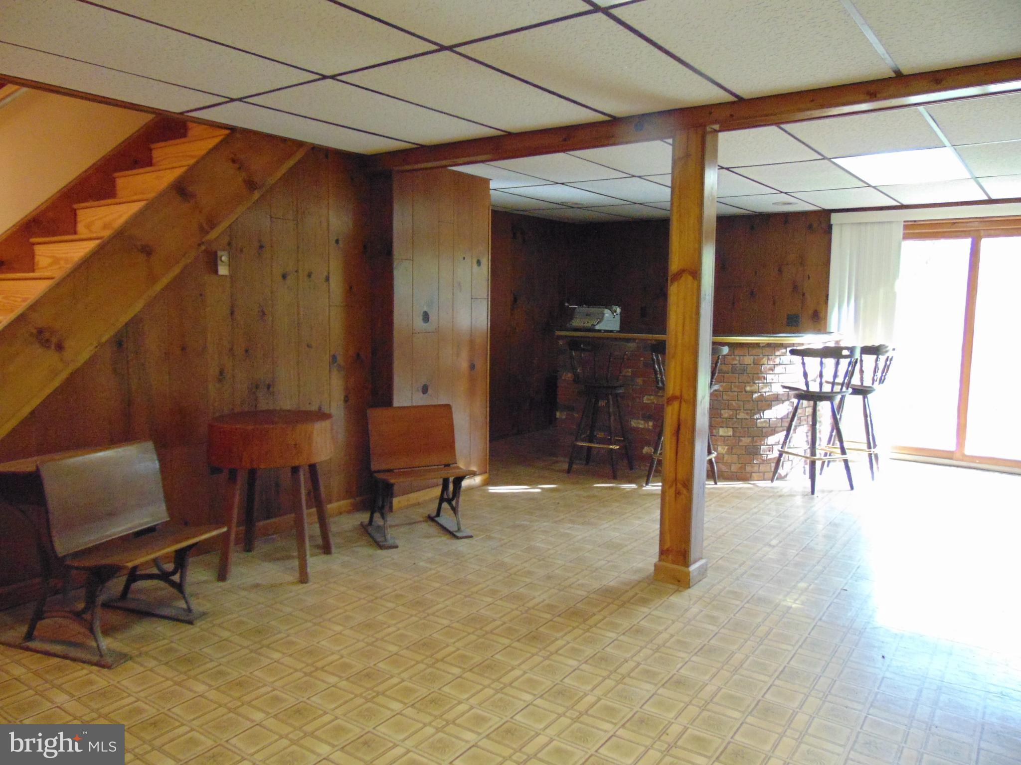 1102 Mill Creek Road Fallston, MD 21047 - Photo 23 of 28 a dining room with furniture and a rug