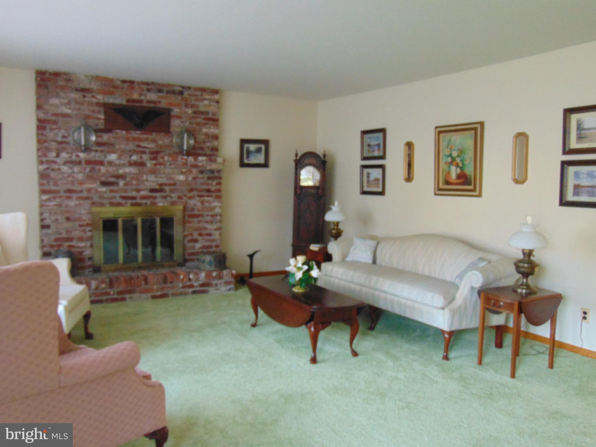 1102 Mill Creek Road Fallston, MD 21047 - Photo 8 of 28 a living room with furniture and a fireplace