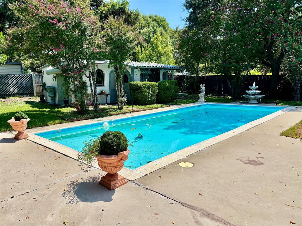5338 West University Boulevard Dallas, TX 75209 - Photo 3 of 8 a front view of a house with a yard