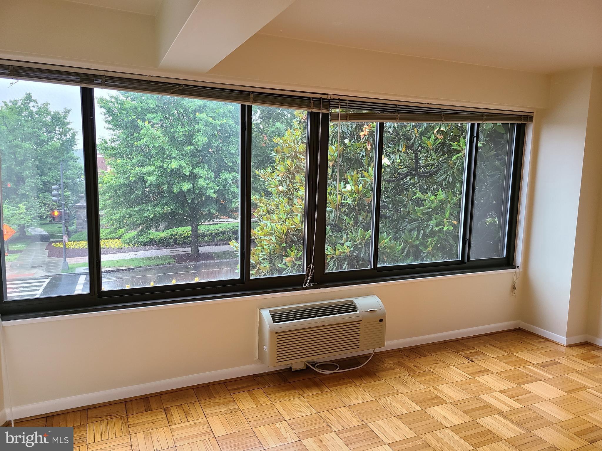 3601 Wisconsin Avenue Northwest, Unit 204 Washington, DC 20016 - Photo 3 of 11 a bathroom with a large window and a bathtub