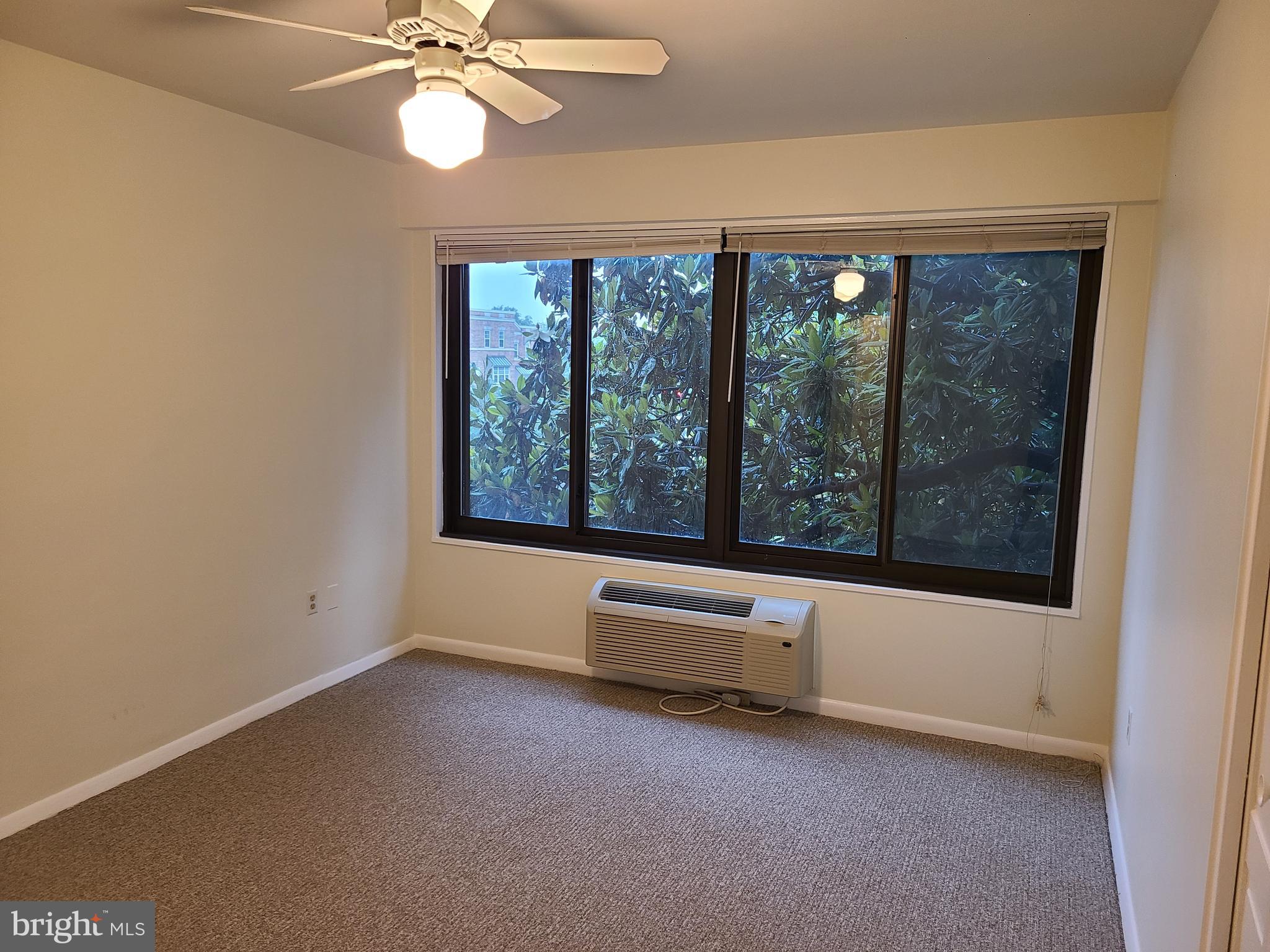 3601 Wisconsin Avenue Northwest, Unit 204 Washington, DC 20016 - Photo 6 of 11 an empty room with windows and outdoor view