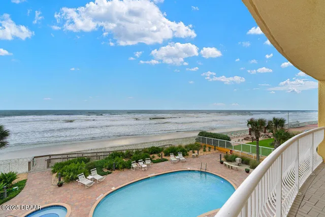 a view of a balcony with an ocean view