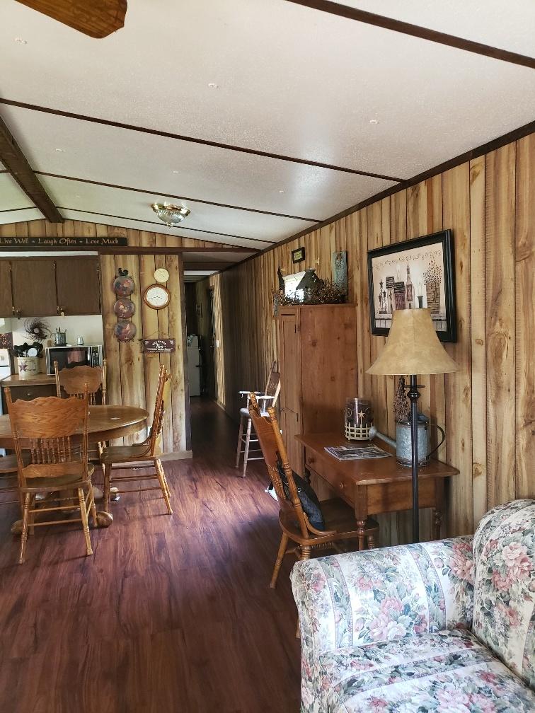 107 Board Mountain Road Goodview, VA 24095 - Photo 4 of 14 a bedroom with furniture and wooden floor