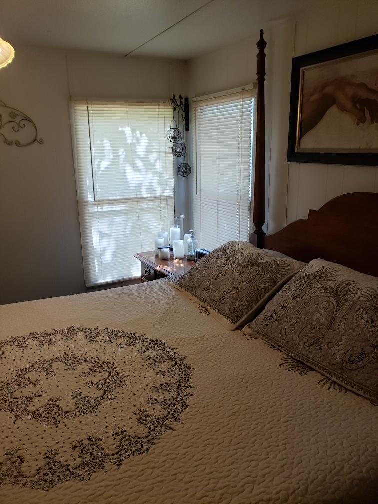 107 Board Mountain Road Goodview, VA 24095 - Photo 5 of 14 a bed sitting in a bedroom next to a window