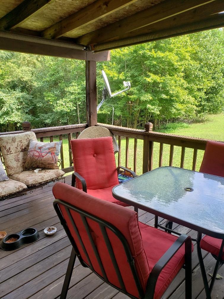107 Board Mountain Road Goodview, VA 24095 - Photo 9 of 14 a view of a living room and furniture in a patio