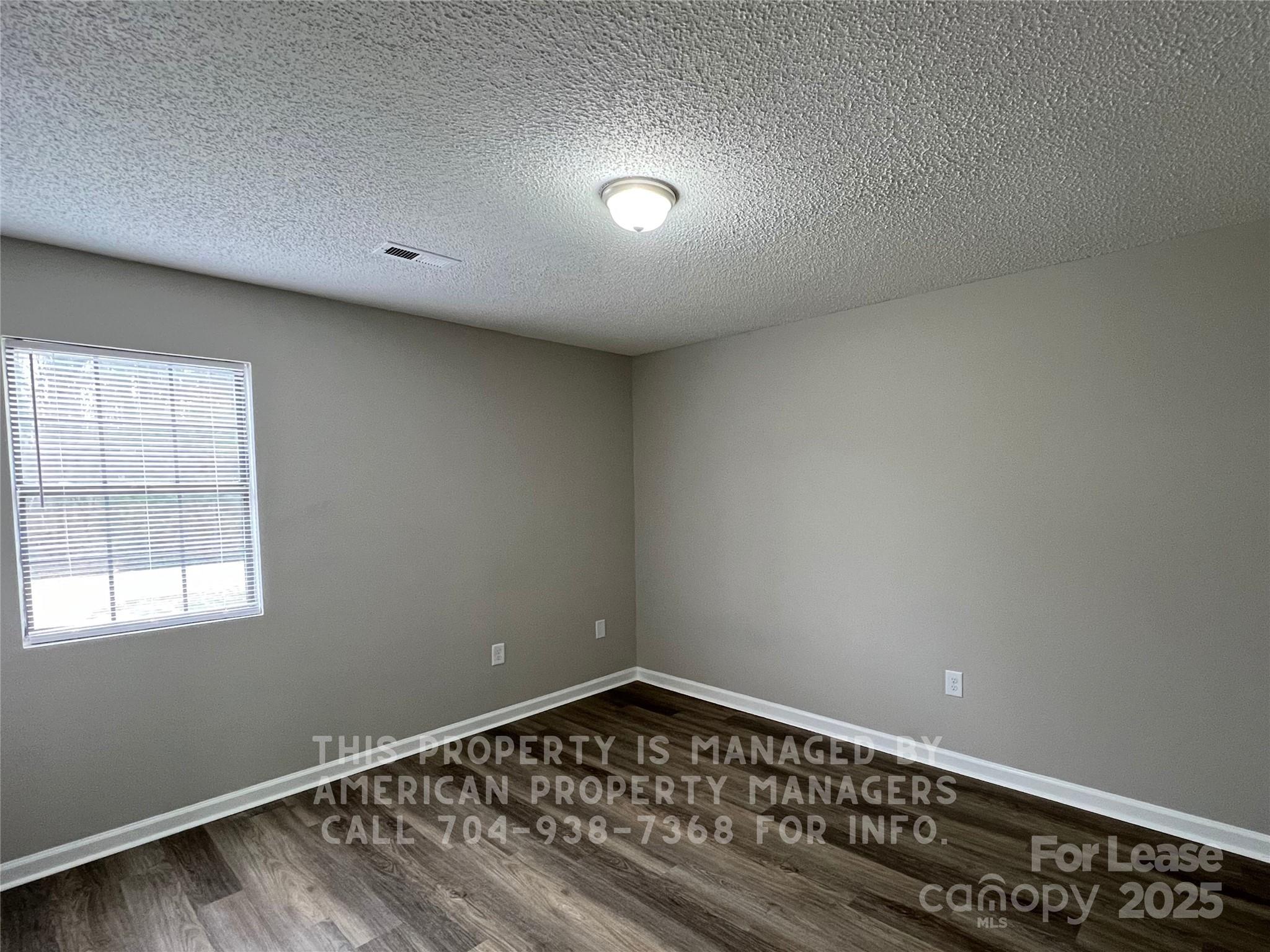 311 Rustic Road Mooresville, NC 28115 - Photo 6 of 10 a view of an empty room and window